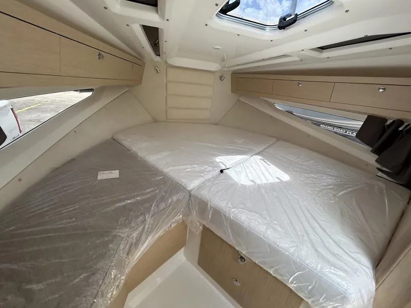 Slide: The Image of 2023 Skamander 850 Voyager boat dashboard with modern controls and touchscreen display. - 18