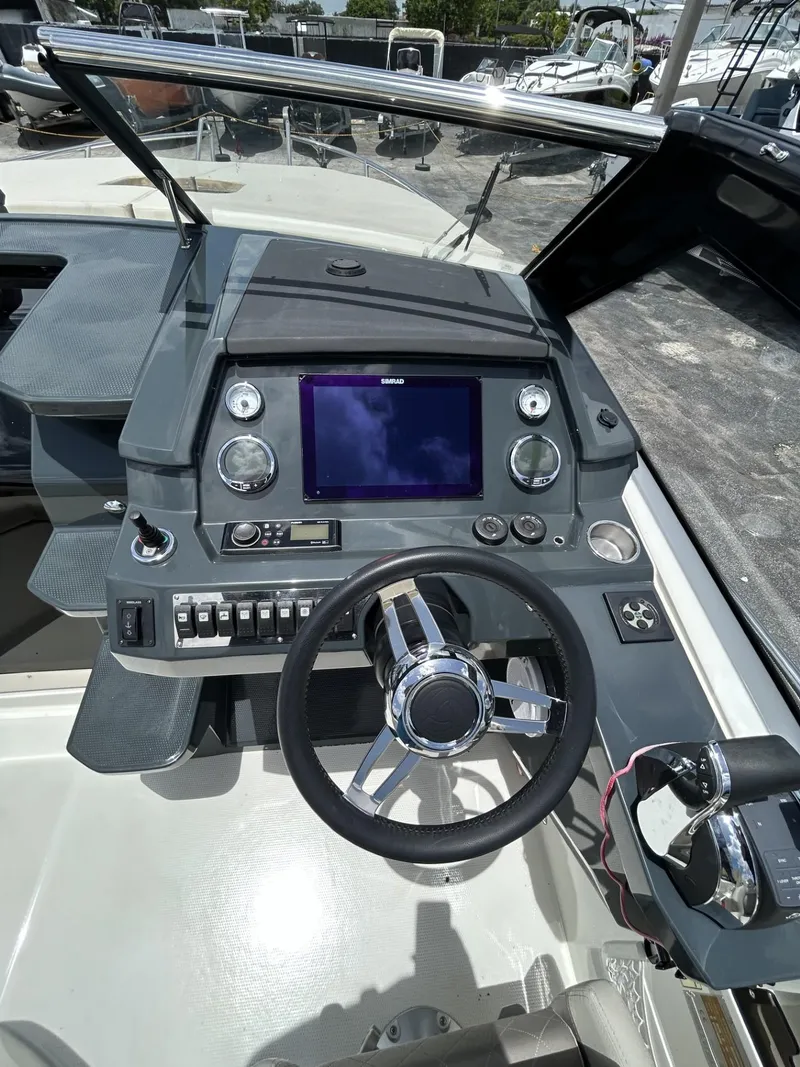 Slide: The Image of 2023 Skamander 850 Voyager boat with spacious deck and modern design. - 23