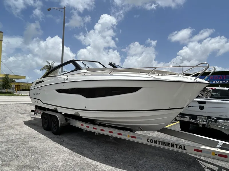 Slide: The Image of Rear view of 2023 Skamander 850 Voyager boat on trailer. - 26