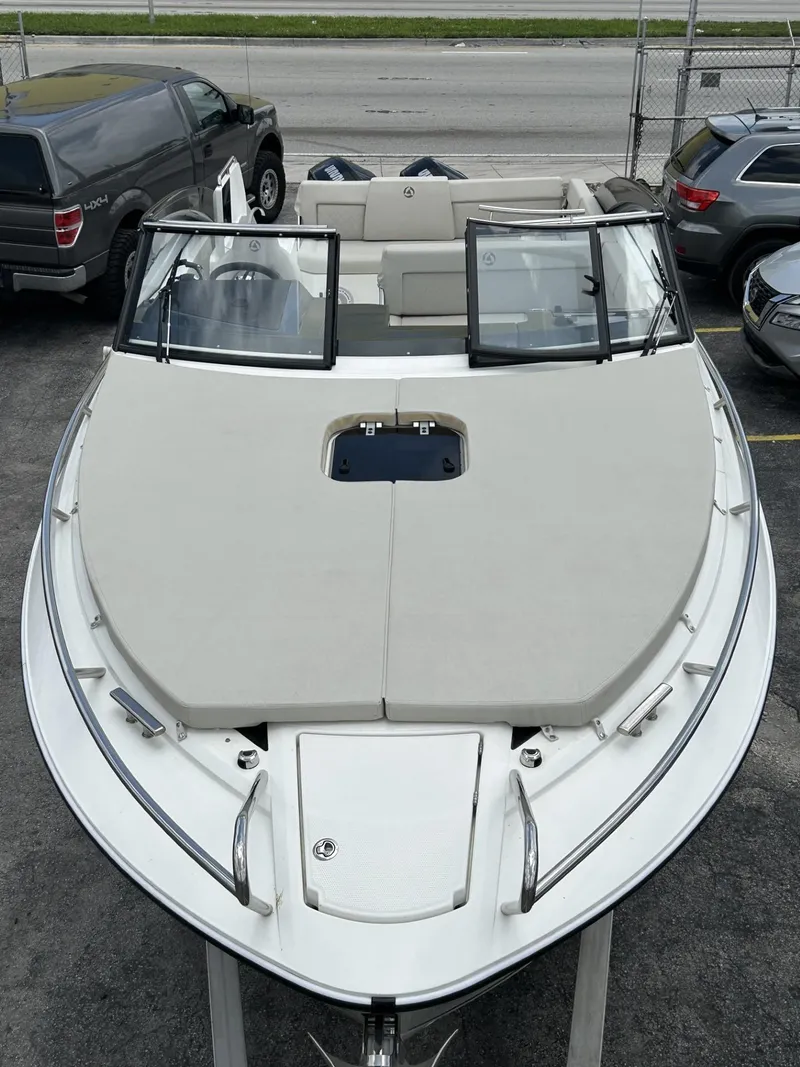 Slide: The Image of 2023 Skamander 850 Voyager boat on a trailer under a cloudy sky. - 28