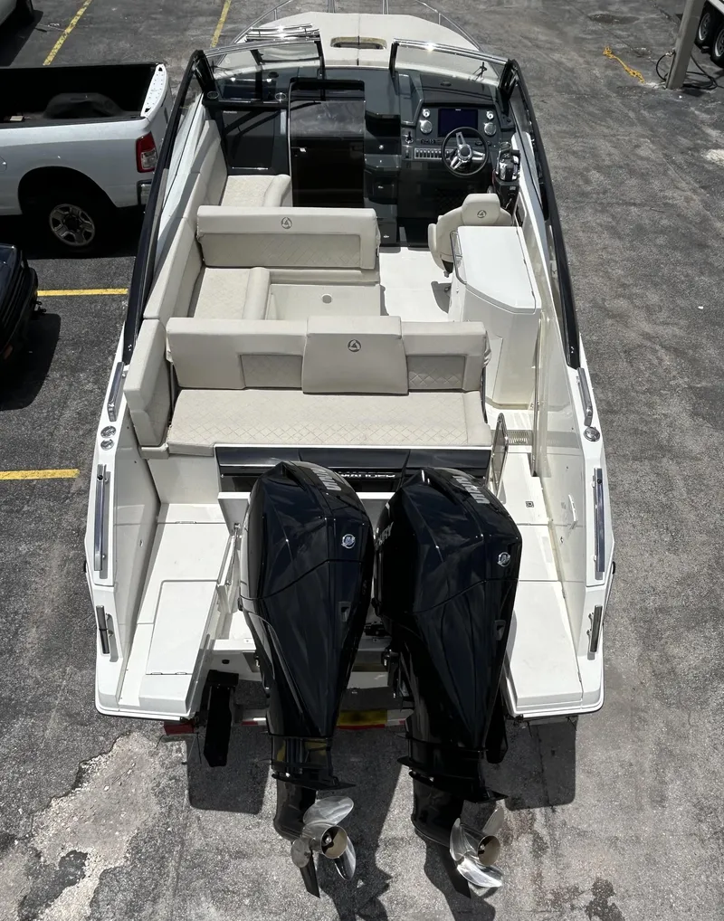 Slide: The Image of 2023 Skamander 850 Voyager boat with dual outboard motors, aerial view. - 3