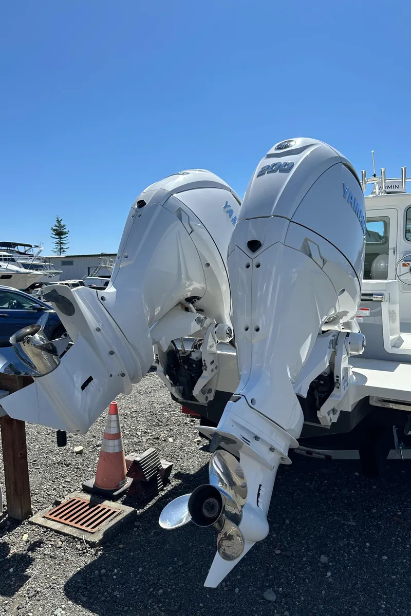 Slide: The Image of Twin Yamaha outboard engines on a 2025 Parker 2420 Sport Cabin boat. - 13