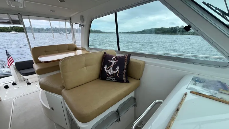Slide: The Image of Interior of 2014 Back Cove 34 boat with seating and scenic water view. - 17