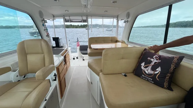 Slide: The Image of Interior of 2014 Back Cove 34 boat with beige seating and nautical decor. - 18