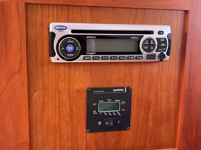 Slide: The Image of Jensen stereo and Xantrex panel on 2014 Back Cove 34 boat interior. - 27