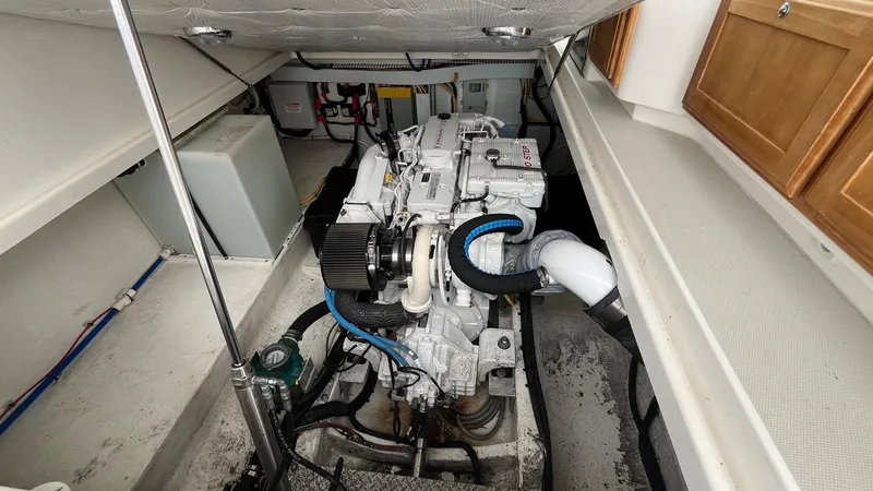 Slide: The Image of Engine room of 2014 Back Cove 34 boat, showcasing clean and organized layout. - 32