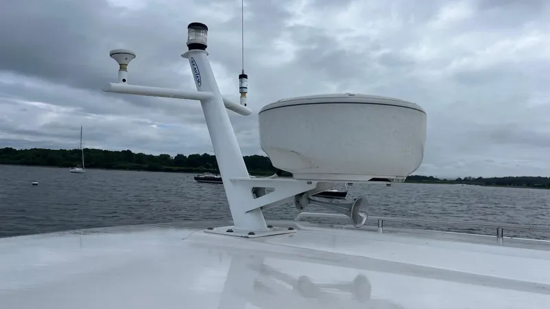 Slide: The Image of Radar equipment on 2014 Back Cove 34 boat against cloudy sky. - 5