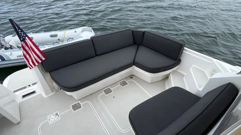 Slide: The Image of Back Cove 34 boat deck with seating, 2014 model, American flag, ocean view. - 7