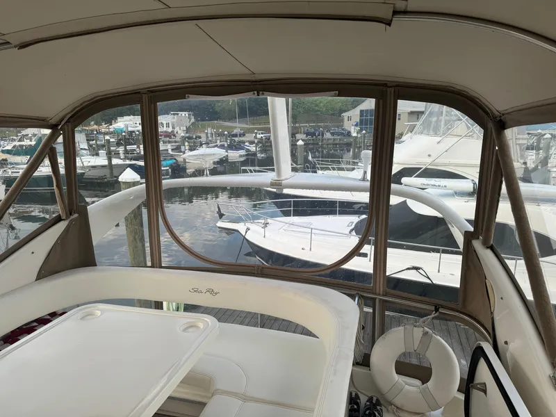 Slide: The Image of Interior view of 2003 Sea Ray 400 Sedan Bridge yacht at marina. - 11