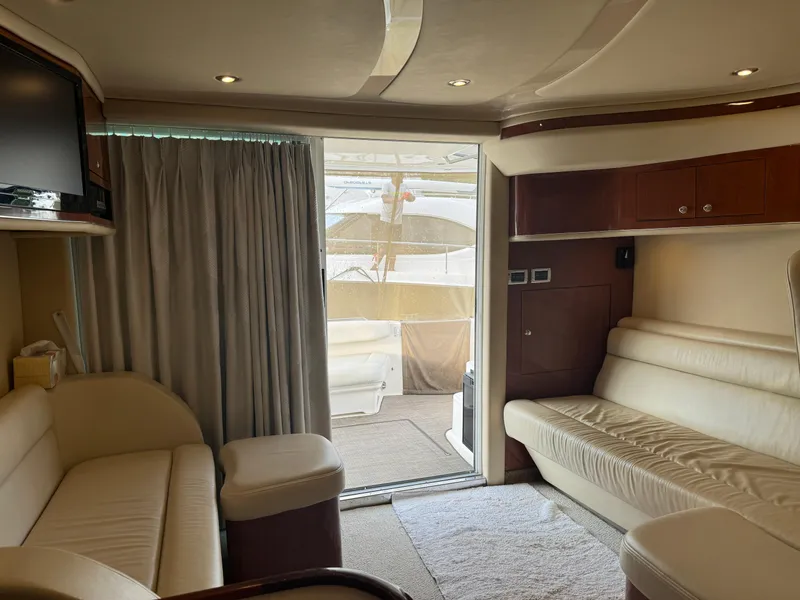 Slide: The Image of Luxurious interior of 2003 Sea Ray 400 Sedan Bridge yacht with cream leather seating. - 15