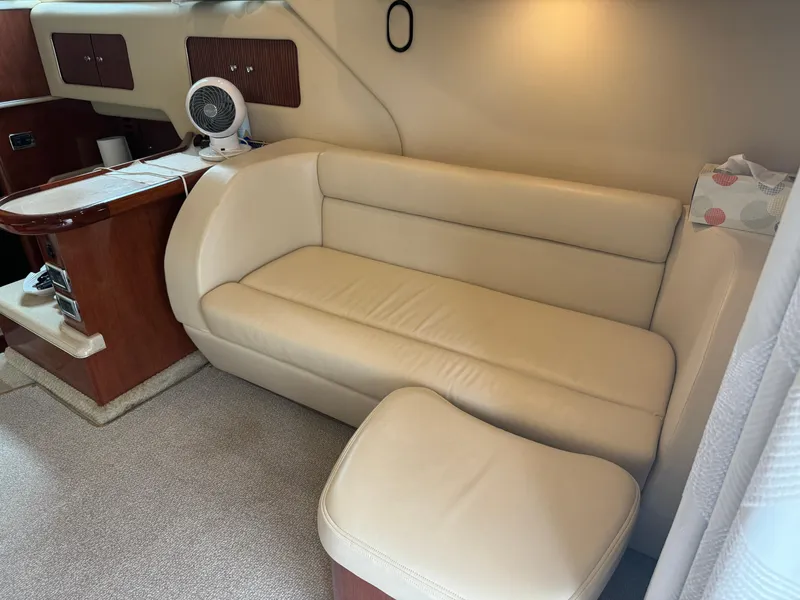 Slide: The Image of Luxurious interior of 2003 Sea Ray 400 Sedan Bridge with beige leather seating. - 19