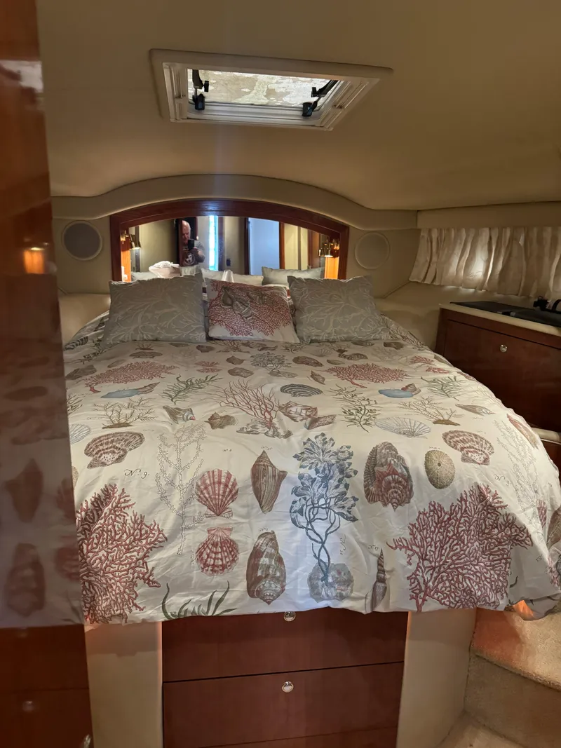 Slide: The Image of Luxurious bedroom interior of 2003 Sea Ray 400 Sedan Bridge yacht. - 24