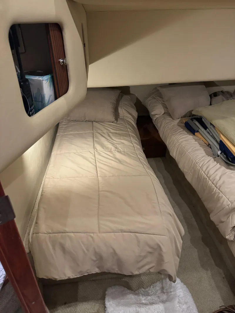 Slide: The Image of Interior cabin of 2003 Sea Ray 400 Sedan Bridge with twin beds. - 27
