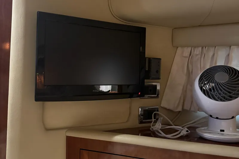Slide: The Image of Interior of 2003 Sea Ray 400 Sedan Bridge with TV and fan. - 30