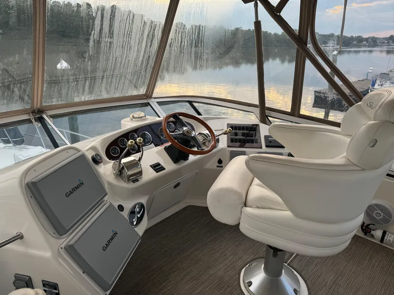 Slide: The Image of Interior helm of 2003 Sea Ray 400 Sedan Bridge with Garmin navigation systems. - 6
