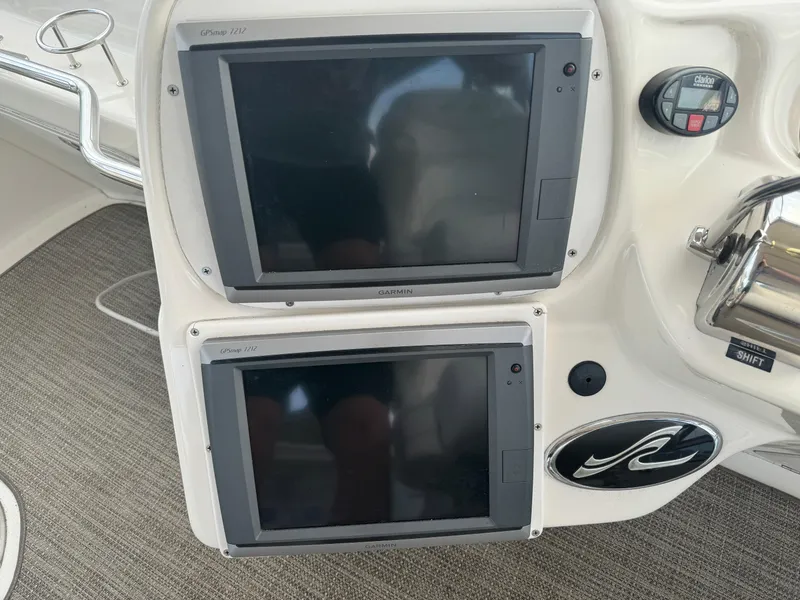 Slide: The Image of Control panel of 2003 Sea Ray 400 Sedan Bridge with dual navigation screens. - 8