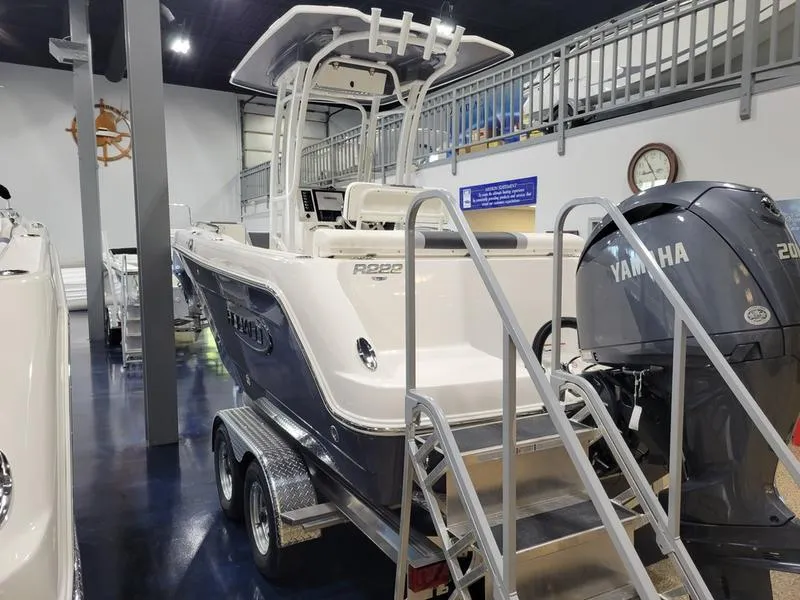 Slide: The Image of 2025 Robalo 222 CC boat with Yamaha engine on display in showroom. - 18