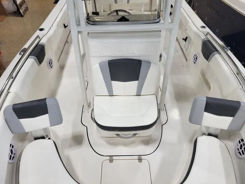 Slide: The Image of 2025 Robalo 222 CC boat interior with white and gray seating. - 3