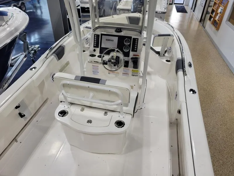Slide: The Image of 2025 Robalo 222 CC boat interior with modern console and seating. - 6