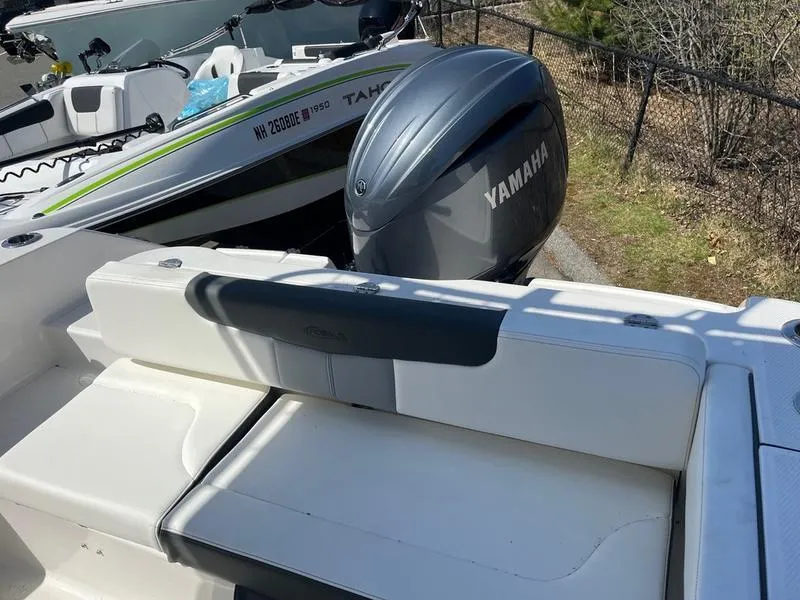 Slide: The Image of 2025 Robalo R 202 EX boat with Yamaha outboard motor, rear seating view. - 5
