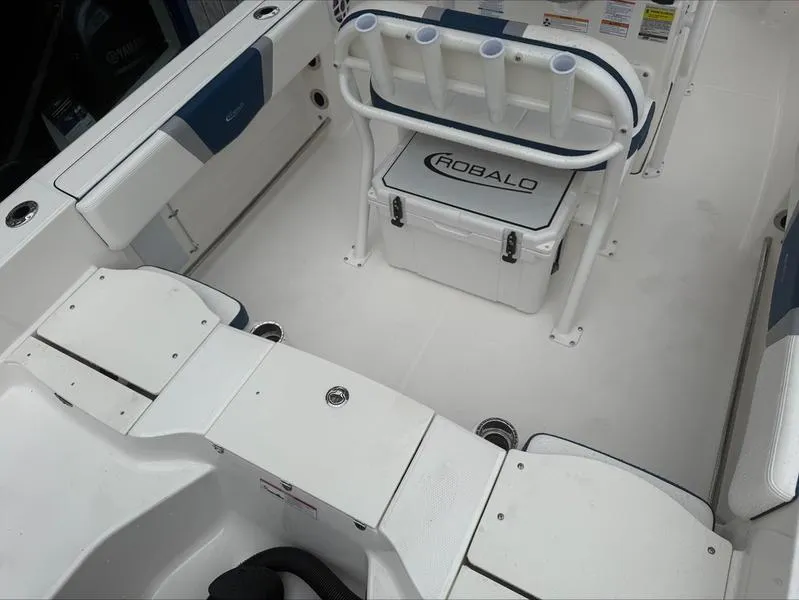 Slide: The Image of 2025 Robalo R 200 boat interior with seating and storage compartments. - 14