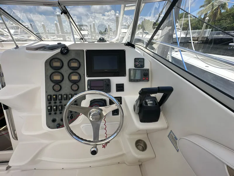 Slide: The Image of 2006 Seaswirl Striper 2901 Walkaround O/B helm with steering wheel and navigation instruments. - 10