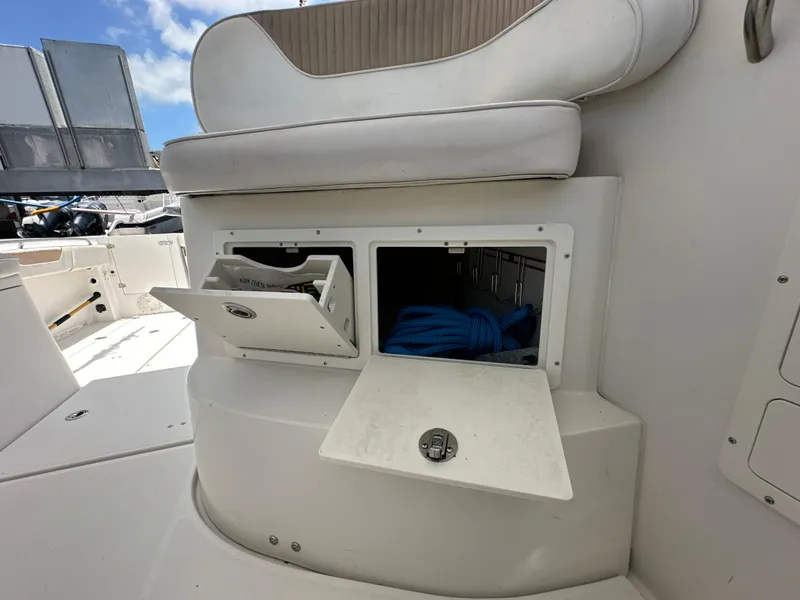 Slide: The Image of 2006 Seaswirl Striper 2901 Walkaround O/B boat storage compartments with open hatches. - 15
