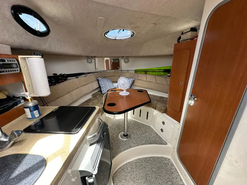 Slide: The Image of 2006 Seaswirl Striper 2901 Walkaround O/B cabin interior with kitchenette and seating area. - 16