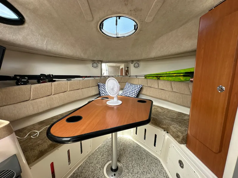 Slide: The Image of Interior cabin of 2006 Seaswirl Striper 2901 Walkaround O/B with table and seating. - 17