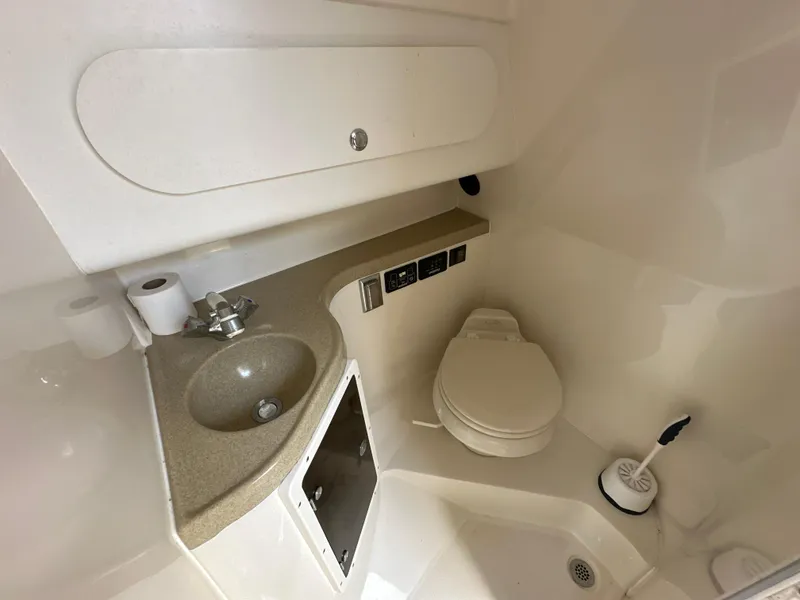 Slide: The Image of 2006 Seaswirl Striper 2901 Walkaround O/B boat bathroom with sink and toilet. - 19