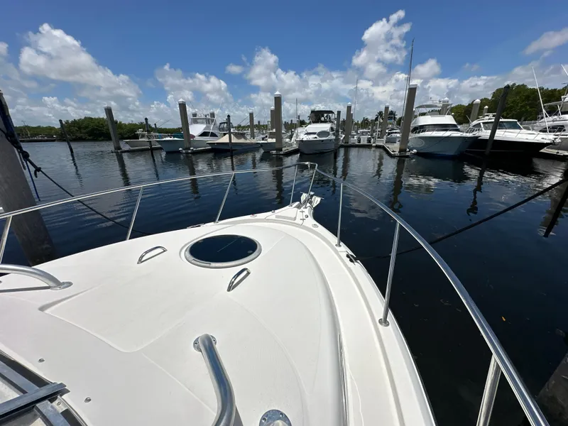 Slide: The Image of 2006 Seaswirl Striper 2901 Walkaround O/B docked at a marina on a sunny day. - 22
