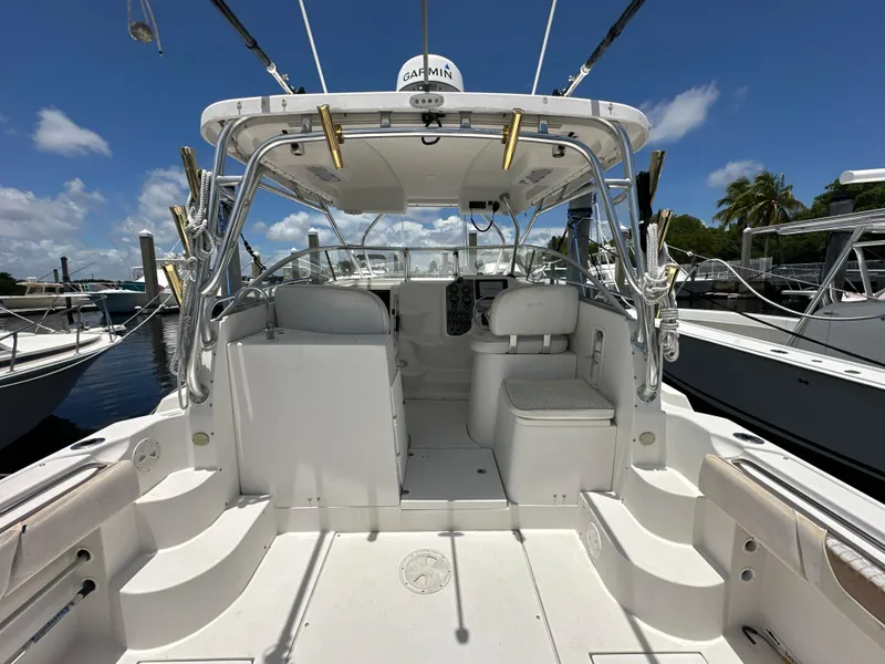 Slide: The Image of 2006 Seaswirl Striper 2901 Walkaround O/B boat interior, docked under clear blue sky. - 5
