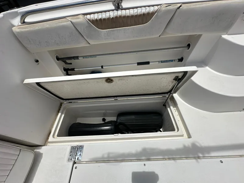 Slide: The Image of 2006 Seaswirl Striper 2901 Walkaround O/B storage compartment with equipment. - 6