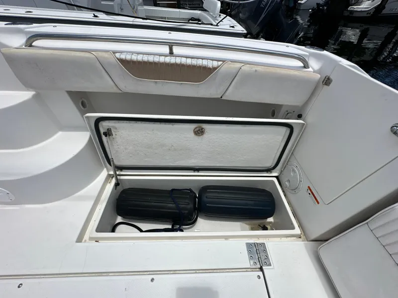 Slide: The Image of 2006 Seaswirl Striper 2901 Walkaround O/B boat storage compartment with fenders. - 7