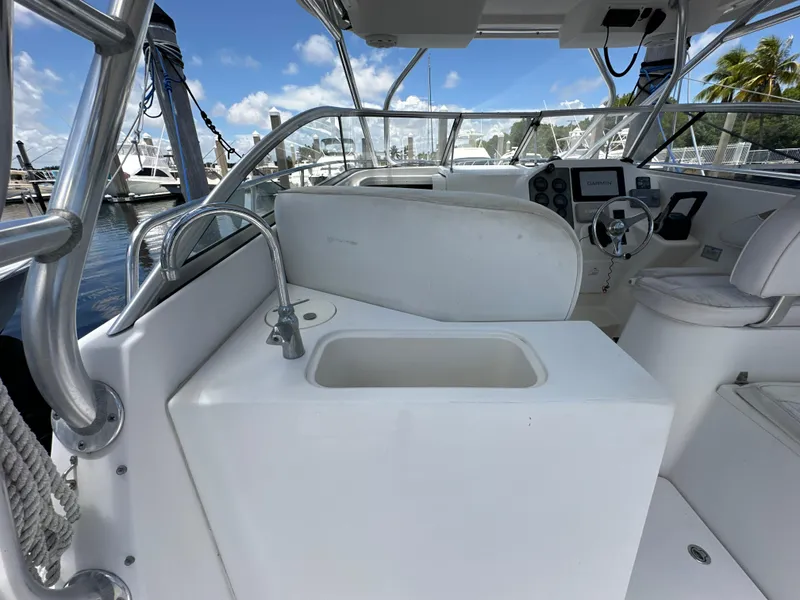 Slide: The Image of 2006 Seaswirl Striper 2901 Walkaround O/B boat interior with sink and steering console. - 8