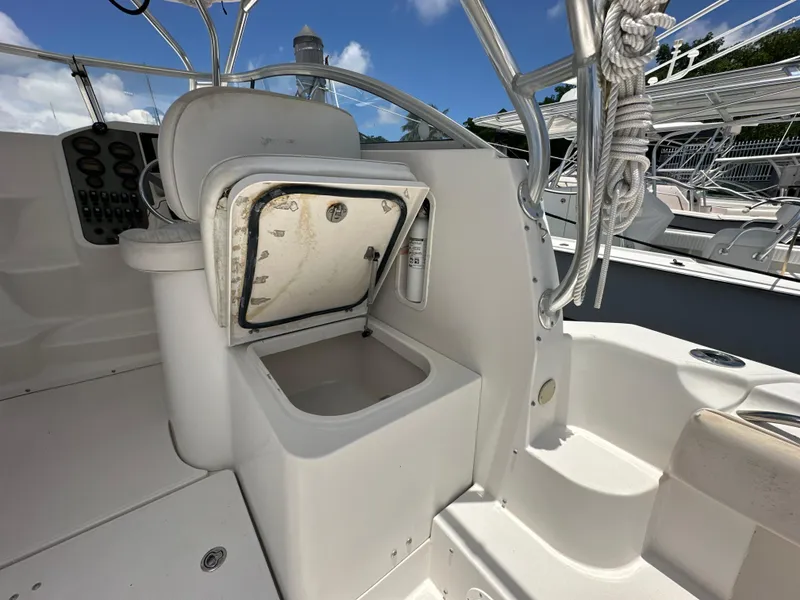 Slide: The Image of 2006 Seaswirl Striper 2901 Walkaround O/B boat interior with open storage compartment. - 9