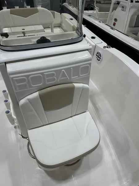 Slide: The Image of 2025 Robalo R 180 boat interior with white seating and console. - 15