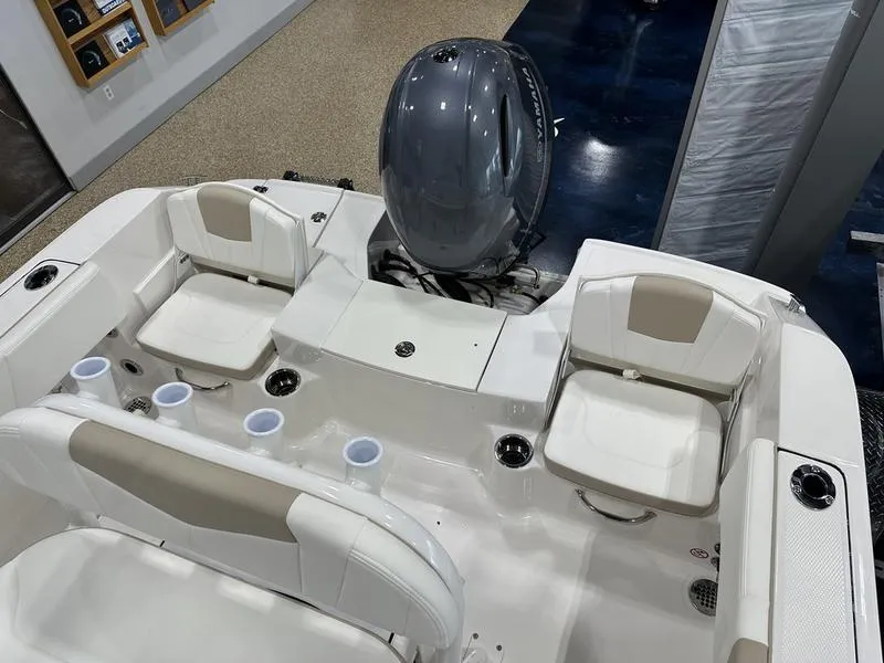 Slide: The Image of 2025 Robalo R 180 boat interior with seating and motor. - 6