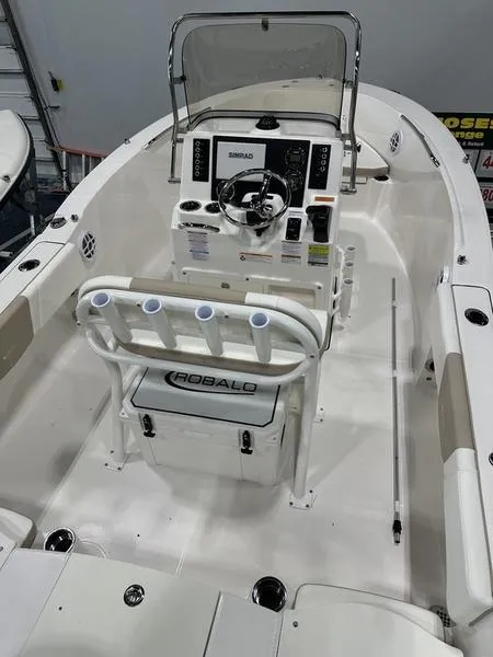 Slide: The Image of 2025 Robalo R 180 boat interior with steering console and seating. - 7