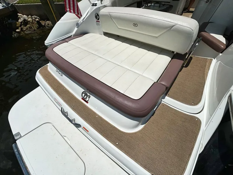 Slide: The Image of 2014 Cobalt 302 boat with white and brown seating and deck. - 3