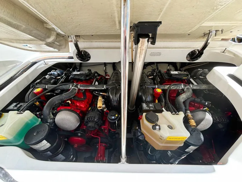 Slide: The Image of Engine compartment of a 2014 Cobalt 302 boat with dual engines. - 6