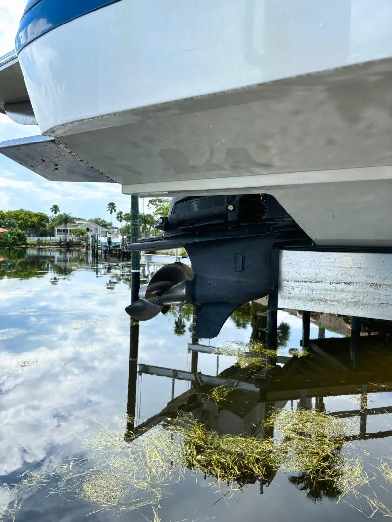 Slide: The Image of 2014 Cobalt 302 boat stern and propeller in water. - 9