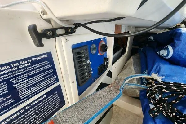 Slide: The Image of Control panel and equipment inside a 1996 Carroll Marine Farr 30 sailboat. - 11