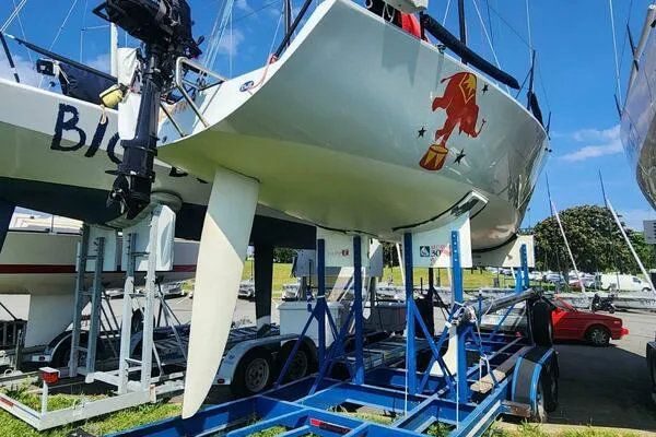 Slide: The Image of 1996 Carroll Marine Farr 30 sailboat on a trailer in a marina. - 15