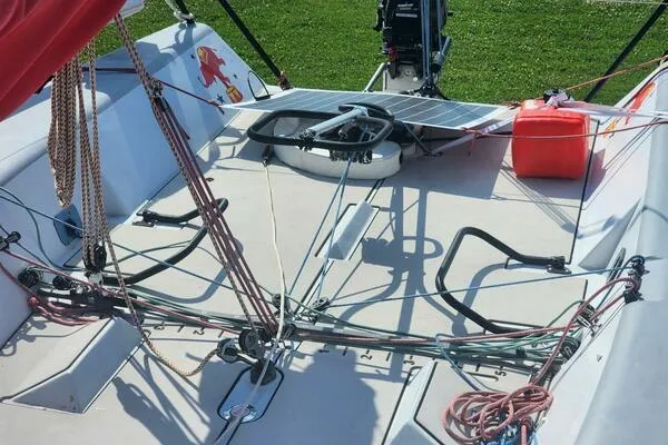 Slide: The Image of Cockpit of a 1996 Carroll Marine Farr 30 sailboat with rigging and steering wheel. - 3
