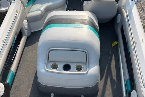Slide: The Image of 1993 MasterCraft Prostar 205 boat interior with cup holders and seating. - 10
