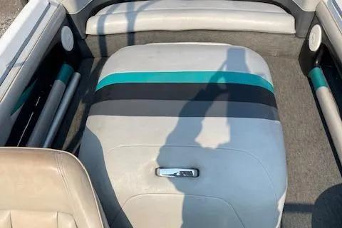 Slide: The Image of 1993 MasterCraft Prostar 205 boat interior with teal and black accents. - 3