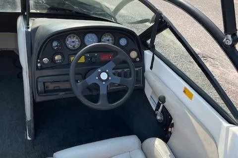 Slide: The Image of 1993 MasterCraft Prostar 205 boat dashboard and steering wheel. - 4