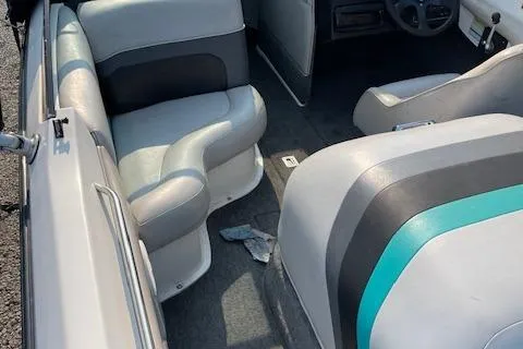 Slide: The Image of 1993 MasterCraft Prostar 205 boat interior with gray and teal seating. - 6