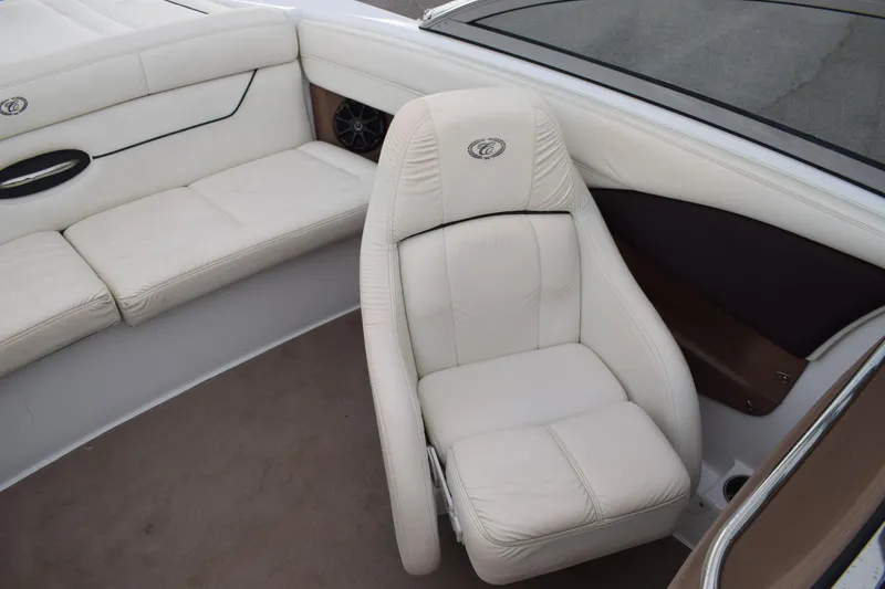 Slide: The Image of 2013 Cobalt 210 WSS boat interior with white leather seats. - 11
